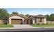 Charming single-story home with a three-car garage and well-maintained landscaping at 3738 E Gold Mountain Ave, San Tan Valley, AZ 85143