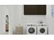 Bright laundry room with modern washer/dryer, cabinets, and a decorative basket at 3738 E Gold Mountain Ave, San Tan Valley, AZ 85143