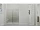 Contemporary shower with marble-look tiling, a glass door, and modern fixtures at 3738 E Gold Mountain Ave, San Tan Valley, AZ 85143