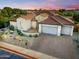 Expansive aerial view of a single-story home with a terracotta roof and a brick driveway at 3753 E Ellis St, Mesa, AZ 85205