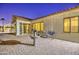 Beautiful backyard featuring a custom-designed brick patio, elegant water feature, and comfortable seating at 3753 E Ellis St, Mesa, AZ 85205