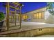 Inviting backyard patio with brick pavers, decorative pergola, and comfortable seating area at 3753 E Ellis St, Mesa, AZ 85205