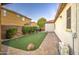 Backyard putting green with a stone accent, and paved patio create a fun outdoor experience at 3753 E Ellis St, Mesa, AZ 85205