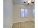 Bedroom with neutral walls, carpet flooring and window with shutters at 3753 E Ellis St, Mesa, AZ 85205