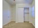 Cozy bedroom features sliding closet and neutral walls with carpet flooring at 3753 E Ellis St, Mesa, AZ 85205