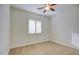 Bedroom with neutral walls, ceiling fan, carpet flooring and shutters at 3753 E Ellis St, Mesa, AZ 85205