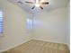 Neutral bedroom with carpet floors, ceiling fan and window with shutters at 3753 E Ellis St, Mesa, AZ 85205