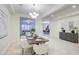 Open-concept dining area with views of living room and kitchen; a cohesive, inviting space at 3753 E Ellis St, Mesa, AZ 85205