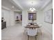 Bright dining room showcasing stylish furnishings, a modern light fixture, and tiled flooring at 3753 E Ellis St, Mesa, AZ 85205
