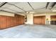 Spacious garage with built-in storage cabinets along the walls and ample space for vehicles and projects at 3753 E Ellis St, Mesa, AZ 85205