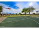 Community basketball court surrounded by greenery provides a recreational space for residents to enjoy outdoor activities at 3971 E Heather Ct, Gilbert, AZ 85234