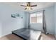 Bedroom with carpeted floor, ceiling fan, and bright natural light from the window at 3971 E Heather Ct, Gilbert, AZ 85234