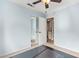 Light blue bedroom featuring a ceiling fan, carpet flooring, and a double door closet at 3971 E Heather Ct, Gilbert, AZ 85234