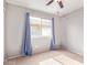 Bedroom with neutral walls, carpet flooring, ceiling fan, and window with curtains at 3971 E Heather Ct, Gilbert, AZ 85234