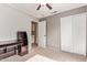 Bedroom with gray walls, carpet, closet, ceiling fan, and desk at 3971 E Heather Ct, Gilbert, AZ 85234
