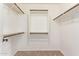 Walk-in closet with custom shelving and organization system for clothing and accessories at 3971 E Heather Ct, Gilbert, AZ 85234
