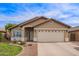 Charming single-story home with a well-maintained lawn, neutral stucco and a two car garage at 3971 E Heather Ct, Gilbert, AZ 85234