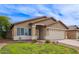 Well-kept single story house featuring a manicured lawn and a two-car garage, captured on a sunny day at 3971 E Heather Ct, Gilbert, AZ 85234
