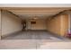 Spacious garage with ample cabinet storage, water heater, and access door at 3971 E Heather Ct, Gilbert, AZ 85234