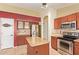 Well-lit kitchen with granite countertops, stainless steel appliances, and pantry at 3971 E Heather Ct, Gilbert, AZ 85234