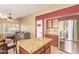 Open kitchen with granite countertops, stainless steel fridge, and decorative backsplash at 3971 E Heather Ct, Gilbert, AZ 85234