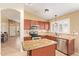 Modern kitchen with granite countertops, stainless steel appliances, and island at 3971 E Heather Ct, Gilbert, AZ 85234