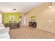 Open-concept living area featuring tile flooring, large window, and a charming dining space at 3971 E Heather Ct, Gilbert, AZ 85234