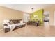 Comfortable living room featuring tile floors, a cozy couch, and bright natural light at 3971 E Heather Ct, Gilbert, AZ 85234