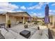 Large backyard includes a patio, firepit and plenty of seating at 4019 W Charlotte Dr, Glendale, AZ 85310