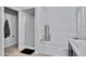Relaxing bathroom features a tub with a shower and updated fixtures at 4019 W Charlotte Dr, Glendale, AZ 85310