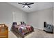 Comfortable bedroom with neutral carpet, plantation shutters and a ceiling fan at 4019 W Charlotte Dr, Glendale, AZ 85310