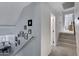 Light and airy hallway features a staircase and access to bedrooms at 4019 W Charlotte Dr, Glendale, AZ 85310