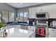 Kitchen with stainless appliances, dark countertops, and white cabinetry at 4019 W Charlotte Dr, Glendale, AZ 85310