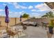 A cozy patio features comfortable seating, a fire pit, and a barbecue grill for ultimate outdoor enjoyment and relaxation at 4019 W Charlotte Dr, Glendale, AZ 85310