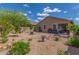 Backyard showcasing desert landscaping, swing set, and privacy walls at 4136 W Palace Station Rd, New River, AZ 85087