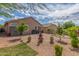 Landscaped backyard featuring low-maintenance desert plants and a fire pit at 4136 W Palace Station Rd, New River, AZ 85087