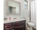 Cozy bathroom featuring a single sink vanity and shower with a curtain at 4136 W Palace Station Rd, New River, AZ 85087