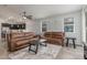 Open concept living room featuring modern lighting, tile floors, and comfortable seating arrangement perfect for entertaining at 4136 W Palace Station Rd, New River, AZ 85087