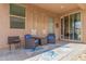 Covered patio with stylish seating area, perfect for outdoor relaxation at 4136 W Palace Station Rd, New River, AZ 85087