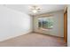 Bedroom featuring neutral walls, carpet and a window with wood trim and horizontal blinds at 4219 E Catalina Dr, Phoenix, AZ 85018