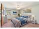 Serene bedroom with a comfortable queen bed, natural light, and calming decor for restful nights at 4219 E Catalina Dr, Phoenix, AZ 85018