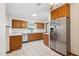 Updated kitchen featuring stainless steel appliances, tile floors, and plenty of cabinet space at 4219 E Catalina Dr, Phoenix, AZ 85018