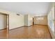 Bright living room with wood-look flooring, large windows, and ample natural light at 4219 E Catalina Dr, Phoenix, AZ 85018