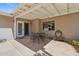Covered patio with a dining table and chairs, offering an ideal space for outdoor gatherings at 4219 E Catalina Dr, Phoenix, AZ 85018