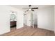 A bright bedroom featuring a ceiling fan, and doors leading to a bathroom and closet at 4310 E Sacaton St, Phoenix, AZ 85044