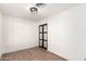 Bedroom featuring wood-look flooring, modern lighting, and a closet with sliding doors at 4310 E Sacaton St, Phoenix, AZ 85044