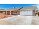 A charming single-story home with red brick, white trim, and a convenient two-car garage at 4310 E Sacaton St, Phoenix, AZ 85044