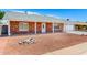 Charming single-story brick home with well-kept landscaping and a convenient attached two-car garage at 4310 E Sacaton St, Phoenix, AZ 85044