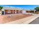 Charming single-story brick home with well-kept landscaping and a convenient attached two-car garage at 4310 E Sacaton St, Phoenix, AZ 85044
