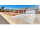 Inviting single-story brick home with well-maintained landscaping and a spacious two-car garage at 4310 E Sacaton St, Phoenix, AZ 85044